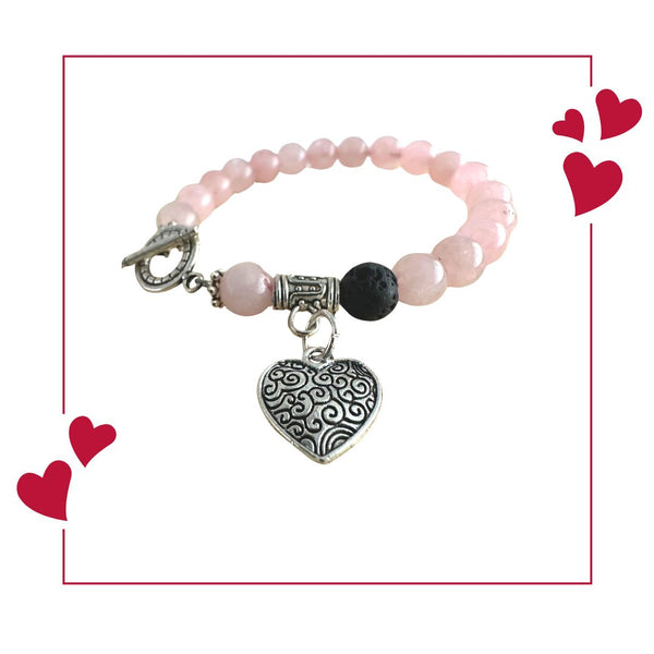 Rose Quartz essential oil diffuser bracelet with heart charm.